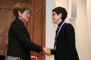 Sarah Mangelsdorf (left) presenting Dr. Catherine Woolley (right)